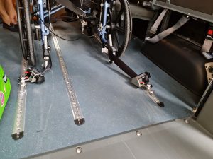 Wheelchair shuttle transport with belt